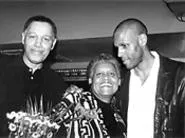 Partners in protection: J. Brown (right) and his parents, Malcolm and - Ernestine