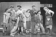 Pees and queues: Urinetown's rebellious poor - confront Penelope Pennywise (Beth McVey, right).