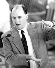 Scott Pullins plays angry taxpayer while cozying up to - money. - JACK KUSTRON/PHOTOJ.COM