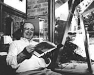 Sculptor David E. Davis, hard at work (Monday).