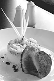 Seared ahi tuna is one of 13 entres on the primary - menu. - WALTER NOVAK