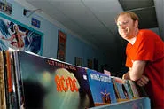 Store owner Jon Mack hawks used vinyl at Hodad's Music in Lakewood. - WALTER NOVAK