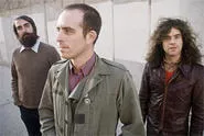 Ted Leo (center) goes nowhere without his two pharmacists.