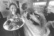 The "barbecued everything" platter, featuring beef, - pork, chicken, scallops, shrimp, and mussels. - WALTER NOVAK