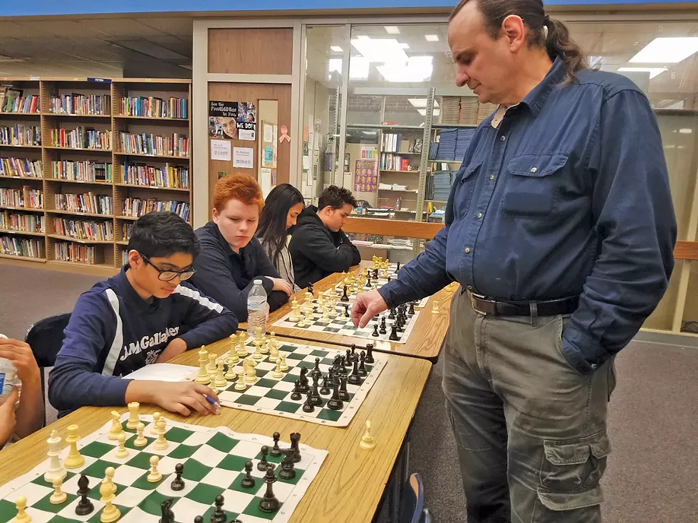Local chess master Steven Seward plays simultaneous games with the team, - but Nouh Shaikh is a worthy challenger. - PHOTO COURTESY OF AMIT GHOSE