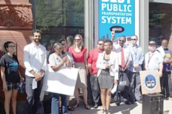 Protesters gather outside of RTA headquarters.