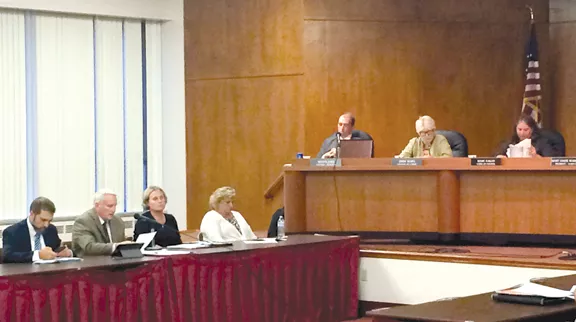 MAYOR MIKE SUMMERS, SECOND FROM LEFT, SPEAKS AT A RECENT CITY COUNCIL MEETING.