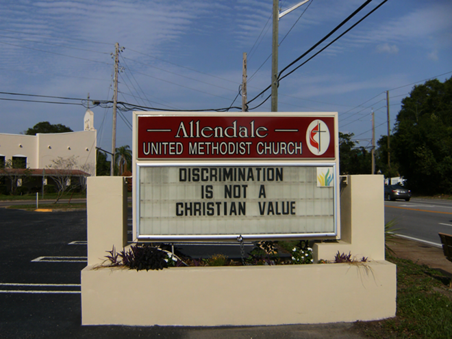 One of the signs demonstrating the church's embrace of the local progressive movement. - DINORAH PREVOST
