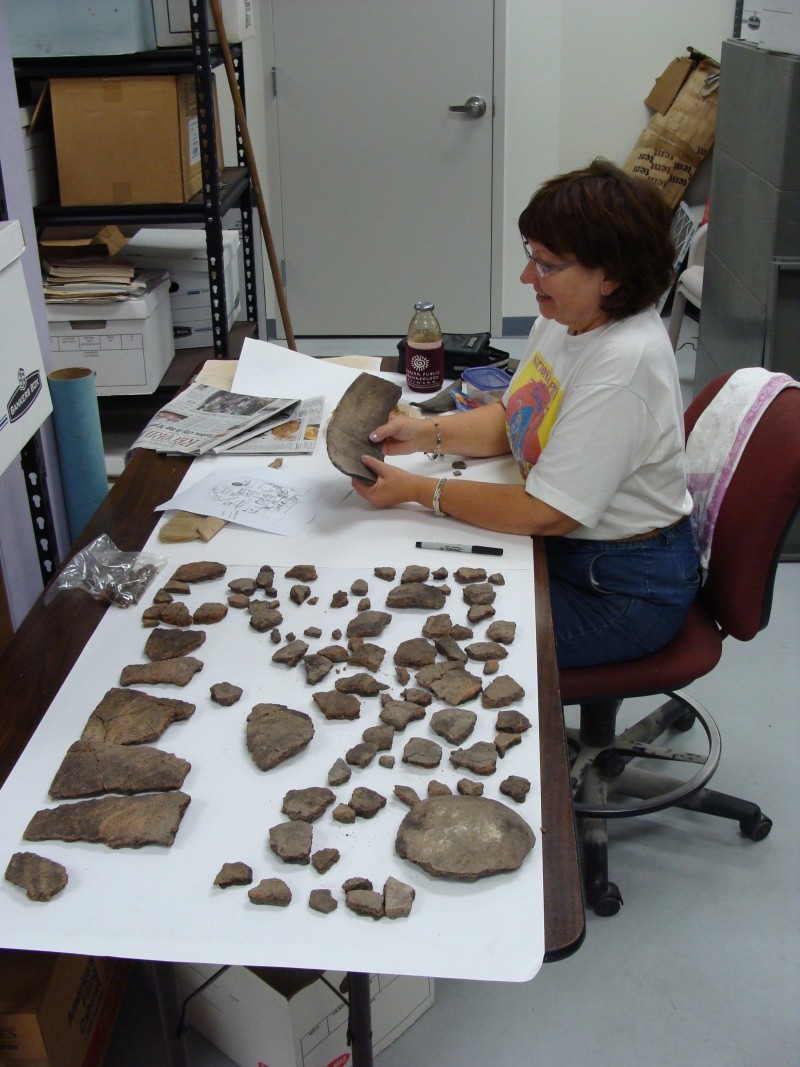 An archaeologist works on some Francis Drake artifacts in St. Augustine.