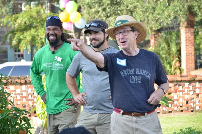Charles H. Morris, Savannah civic leader and owner of Trustees' Garden, greets volunteers before the celebration at the CRI Healthy Garden. Also shown are Trustees' Garden Ambassador Paul Arkwright, III (left) and Kerry Shay, co-owner of Victory Gardens and advisor to the CRI Healthy Garden. Photo by James Byous, © Canyon Ranch Institute.