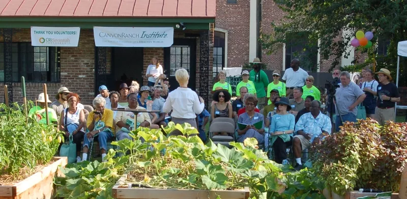 CRI Executive Director and Board Member Jennifer Cabe (center) addresses friends, supporters, and volunteers of the CRI Healthy Garden at Trustees' Garden about future plans to expand the garden with input from people of all walks of life across Savannah. Photo by Andrew Pleasant, © Canyon Ranch Institute.