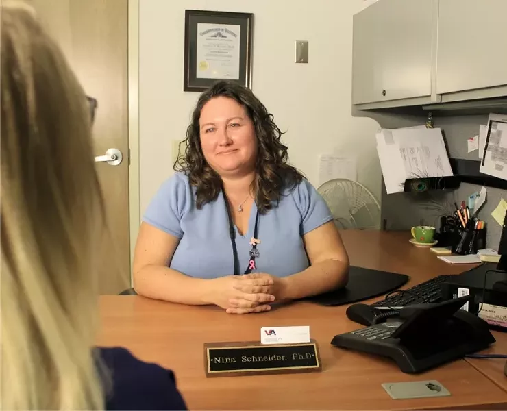 Dr. Nina Schneider listens to and learns from veterans with PTSD as part of a VA study. Participants can begin receiving treatment immediately. - LINETTE DUBOIS