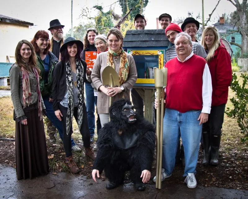 Friends of newlyweds Francis Allen and Leslie Lovell (r. and l. of the gorilla) helped dedicate the first FOC Little Free Library. - JON WAITS/@JWAITSPHOTO