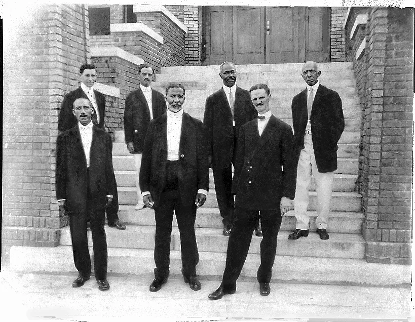 front row, l. to r.) Carnegie Library founders E.E. DesVerney, Burton H. Pearson and A.L. Tucker stand with (back row, l. to r.) Duncan Scott, Dr. F.S. Belcher, Sol C. Johnson and C.A. McDowell, who served as the institution's first librarian.