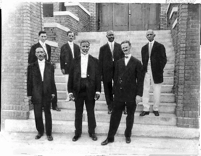 front row, l. to r.) Carnegie Library founders E.E. DesVerney, Burton H. Pearson and A.L. Tucker stand with (back row, l. to r.) Duncan Scott, Dr. F.S. Belcher, Sol C. Johnson and C.A. McDowell, who served as the institution's first librarian.