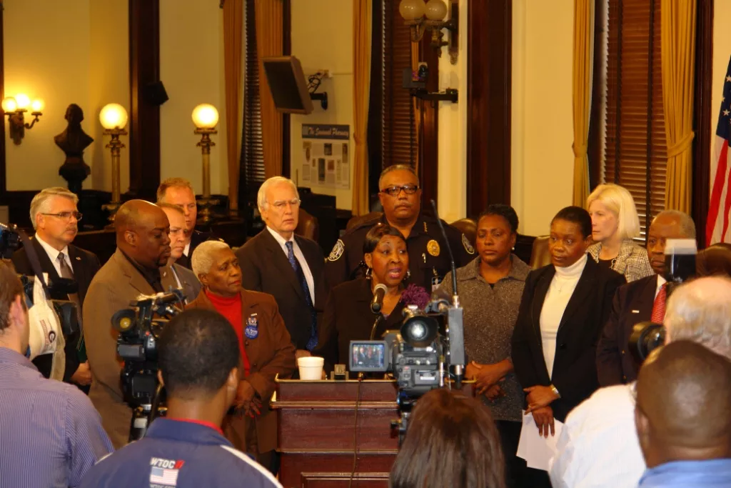 In better days, former Chief Willie Lovett stands directly behind Mayor Edna Jackson with other members of City Council