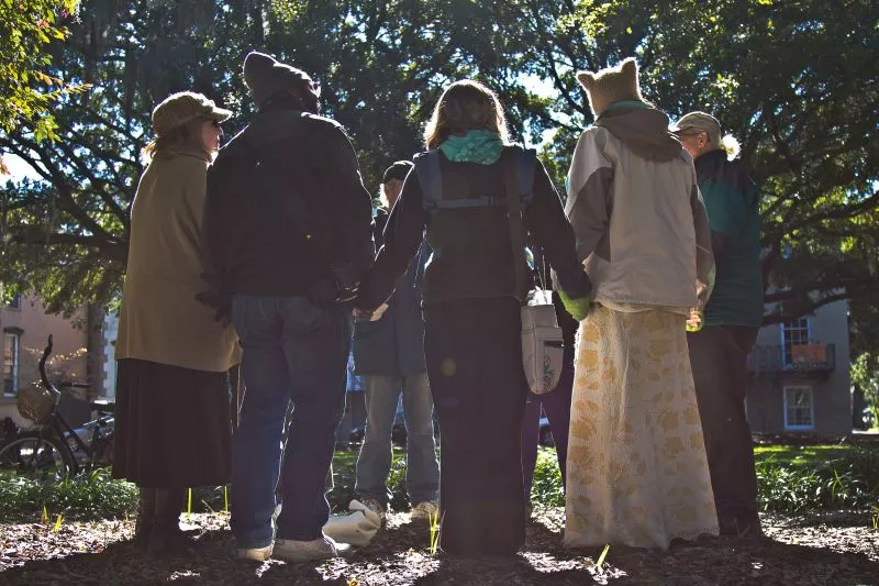 The last of the noontime chimes of the Cathedral of St. John the Baptist could still be heard last Wednesday on Lafayette Square as the circle came together. - PHOTOS BY JON WAITS/@JWAITSPHOTO