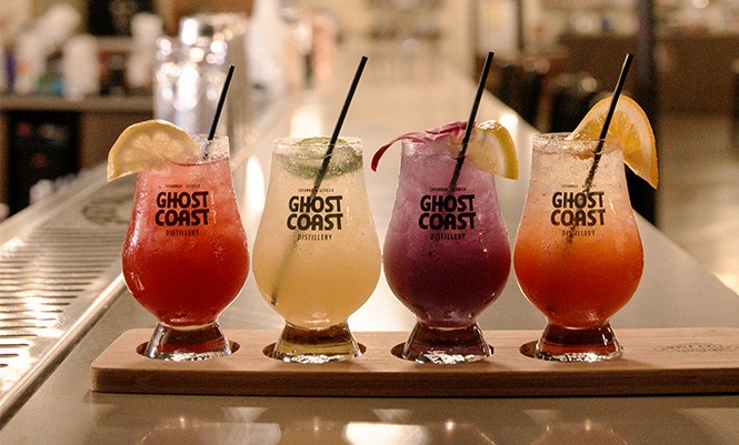 Drinks made with Ghost Coast Distillery spirits are arranged on the bar inside the venue's new cocktail room. - PHOTO COURTESY OF GHOST COAST DISTILLERY