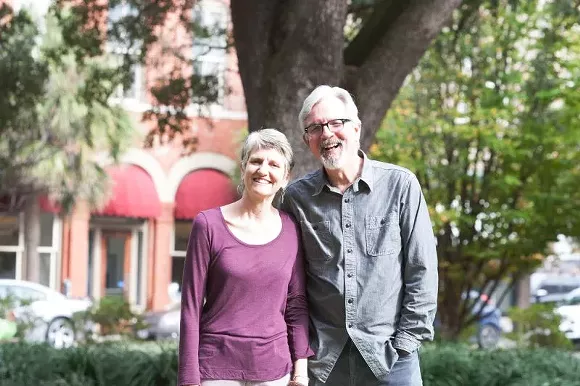 Ann Curry and Rev. Enoch Hendry have lived on the top floor of historic Trinity UMC for 14 years. The reverend retires at the end of May, and it’s time to turn in the keys. - PHOTO BY LYN BONHAM