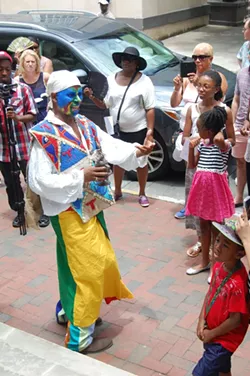 Jamal Touré calls on the ancestors at the opening ceremony of the Telfair Museums’ Juneteenth Festival, now in its tenth year of celebrating freedom from slavery.