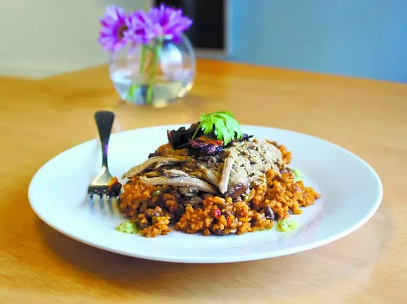 A taste of Puerto Rico with Nana’s Arroz con Pollo - (chicken with rice), made with sazon roasted chicken thighs.