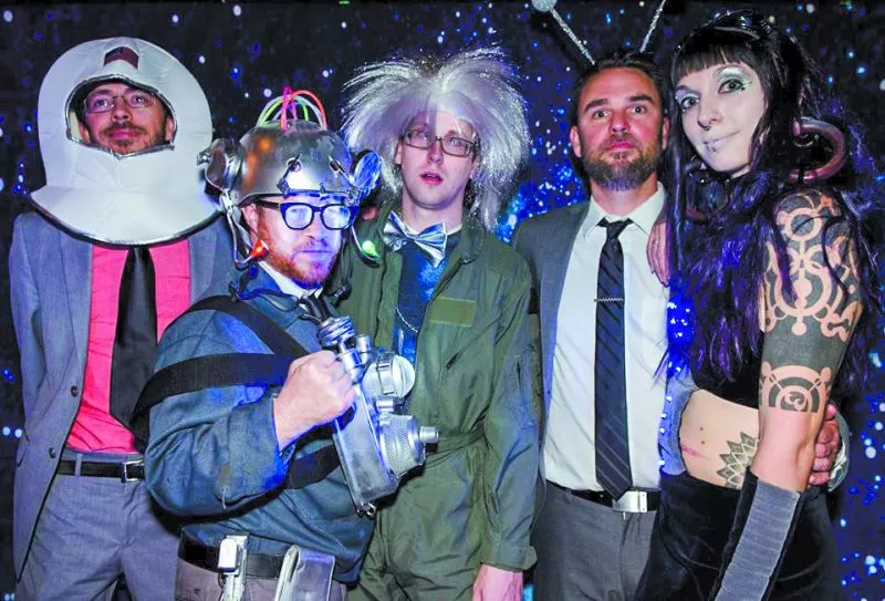 The Wave Slaves strike a pose in the 3rd Annual Rock & Roll Prom photo booth. - PHOTO BY PETERSON WORRELL