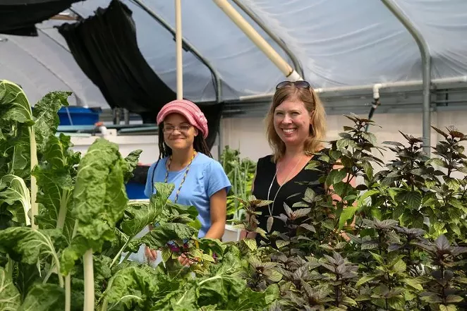 Dr. Heather Joesting (R) oversees experiments with the help of student Sakile Johnson at the FORM Sustainable Aquaponics Research Center. - PHOTOS BY JON WAITS /@JWAITSPHOTO