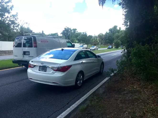 People who walk north toward Savannah Tech on White Bluff must walk through the grass and weeds and on the shoulder for most of the way. Until the shoulder disappears, forcing people into the street.