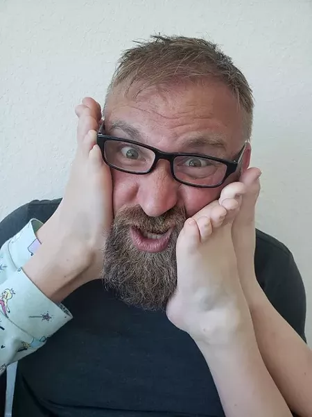 Tommy Nickoloff, with unidentified feet.