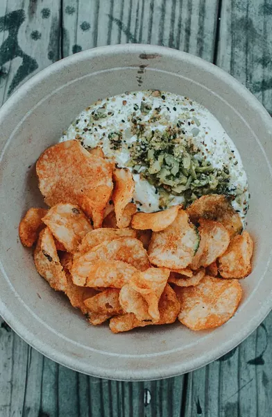 Labneh, dukkah, green olives, and Zapps chips.