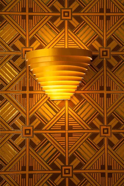 Vintage wallpaper and stunning sconces line the walls of El-Rocko. - JON WAITS | @JWAITSPHOTO