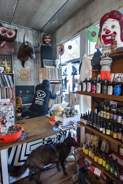 Graveface behind the counter. - PHOTO BY GEOFF L. JOHNSON