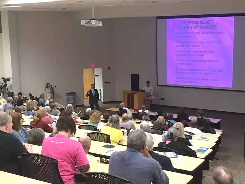Buddy Carter begins the town hall with a brief Powerpoint presentation before taking questions from the crowd