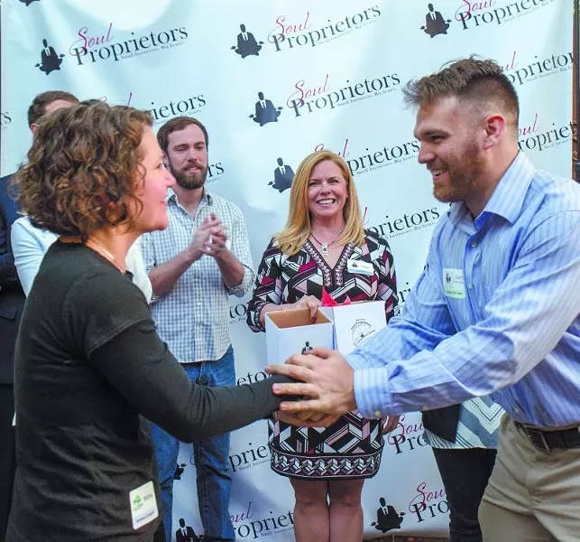 Green Truck Pub’s Whitney Yates (l.) meets Zachary Burke of Ardsley Park Productions as Soul Proprietors founder Debbie Brannigan looks on.
