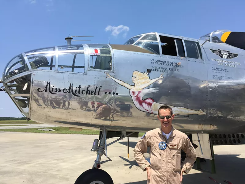 Pilot In Command Matt Quy, U.S. Air Force and Commemorative Air Force, with 'Miss Mitchell.' The nose art is by the original artist. - PHOTO BY JIM MOREKIS