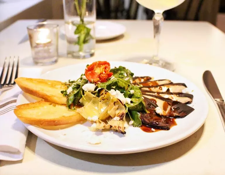 Grilled Portobello and Artichoke Salad. with arugula, roasted tomato, Bootleg Farms feta, local honey and a grilled baguette.