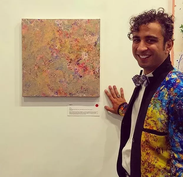 The artist with his work.