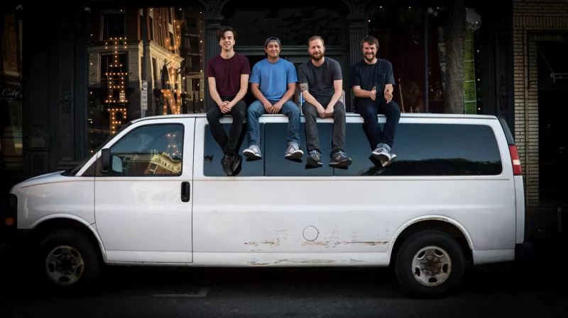 The Passafire guys kick their feet up outside The Jinx.