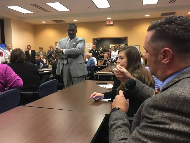 Rev. Kevin Veitinger speaks as Joseph Ervin, moderator and chair of the Chatham-Savannah Authority for the Homeless, looks on. - PHOTO BY JIM MOREKIS