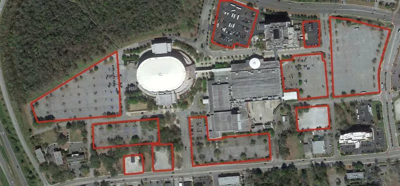 Aerial photo of North Charleston Coliseum with close parking lots outlined in red. It’s still not enough — a new $50 million garage is being built to meet parking demand. Source: Google Earth