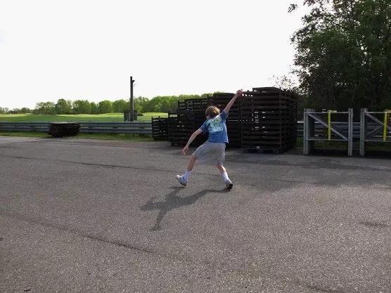 road_bowling-kid_pitching_down_the_road.jpg