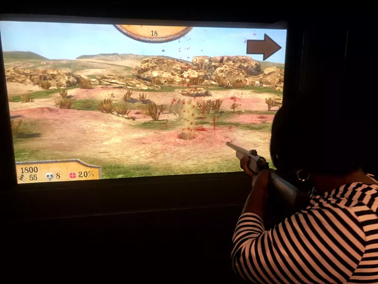 Kelli Nicole McClain blows away some desert varmints for points during a round of Prairie Dog Hunt at the Crush It! Virtual Sports Lounge. - DANNY GALLAGHER