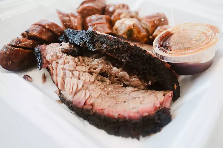 Sunbird Barbecue's Bryan Bingham puts his brisket-smoking prowess on full display in Longview. - CHRIS WOLFGANG