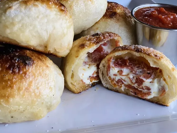 Pepperoni puffs served with organic tomato sauce and garlic mascarpone cheese ($10). - PT NEIGHBORHOOD PIZZERIA