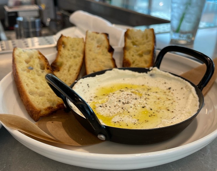 Foccacia with whipped ricotta from Dive In, the residents-only restaurant at The Village. - ANGIE QUEBEDEAUX