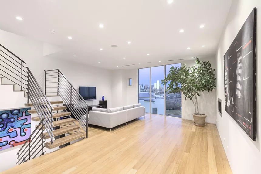 The simple design of the condominium frames the city view and the art collection well.  - BARRY SNIDOW