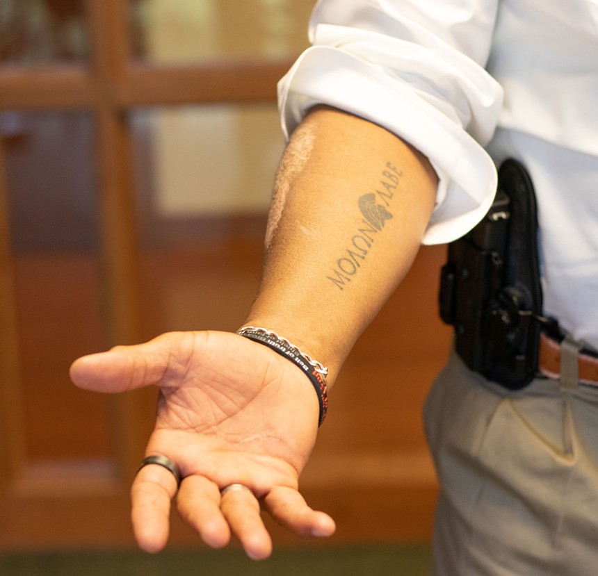 “Come and take [them],” reads a tattoo on - Allen West’s forearm. - SIMONE CARTER