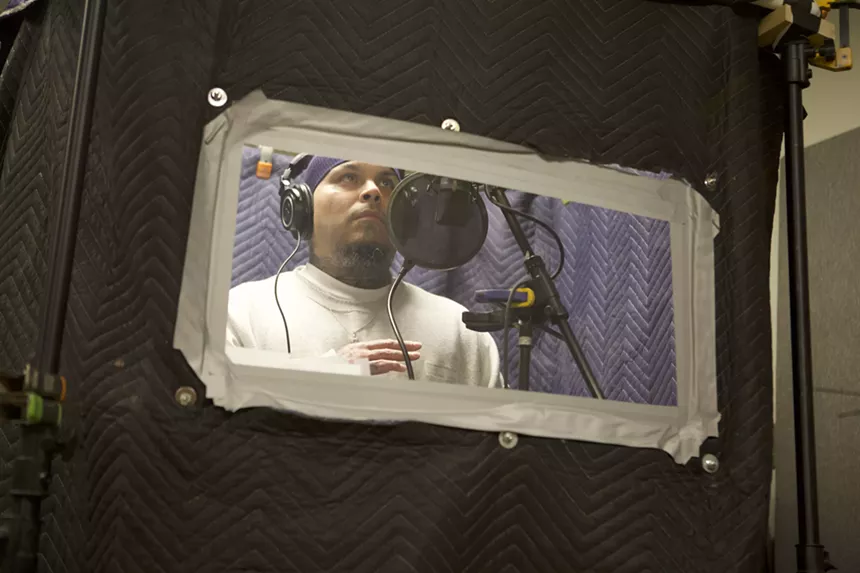 Jose "8Bizz" Talamantes records a rap verse for the track "Mama's Cryin'." - COURTESY OF DIE JIM CROW RECORDS
