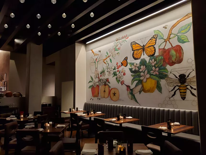 The chalk mural in the Apple Blossom dining room was hand-drawn by pastry chef Jodi Polson. - MOLLY MARTIN