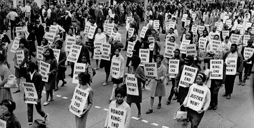 Ernest C. Withers, "Memorial March after assassination of MLK, Main St Memphis, April 8, 1968," silver gelatin print, printed later. - © THE ESTATE OF ERNEST C. WITHERS